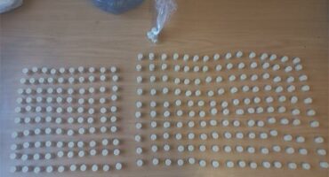 a table full of drug tables