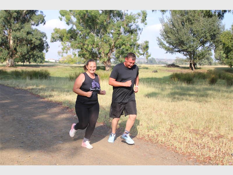 Two people with back exercise clothes
