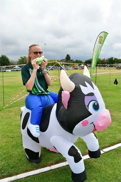 A girl wears a costume that looks like a cow