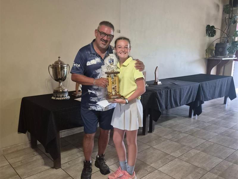 man gives girl a trophy