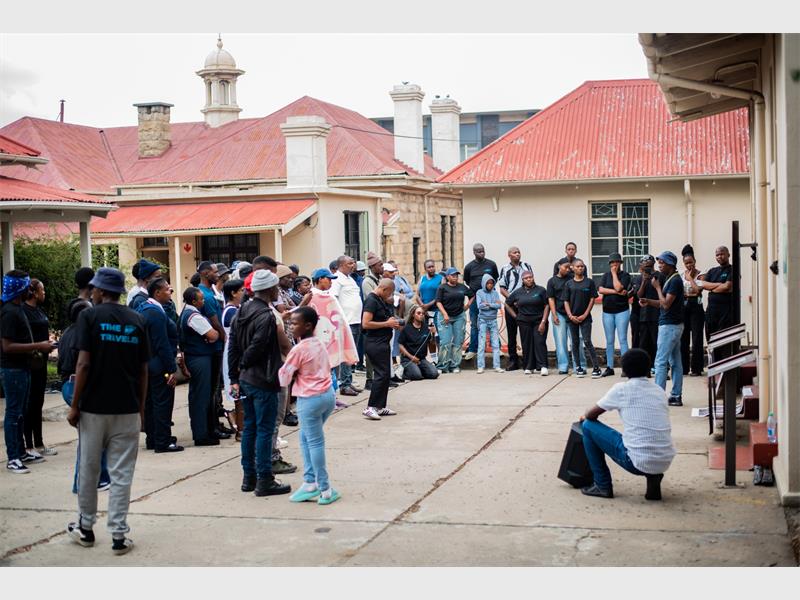 people stand in a square