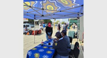 people under a police gazebo