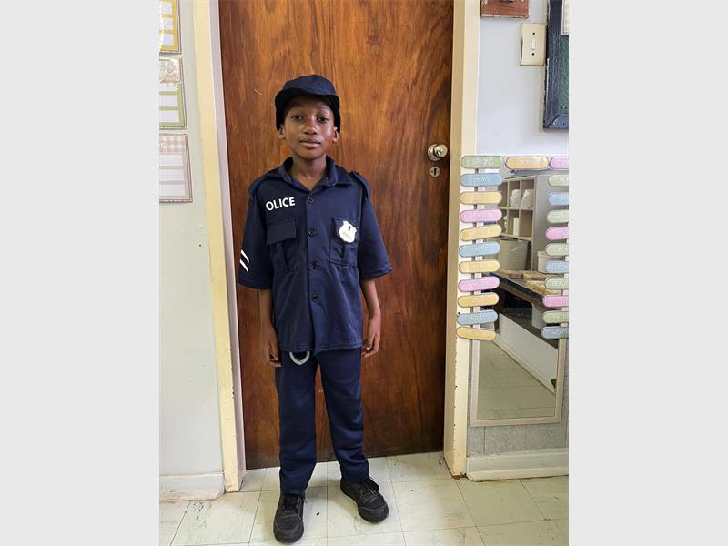 Manqoba Lukhele dressed as a policeman.