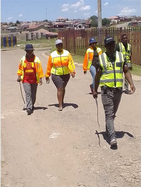 Community safety patrols in a residential area, promoting security and vigilance.