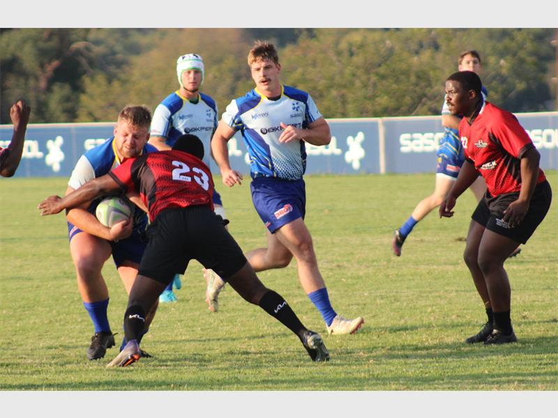 Sasol and Newcastle rugby players, George Groenewald with the ball.