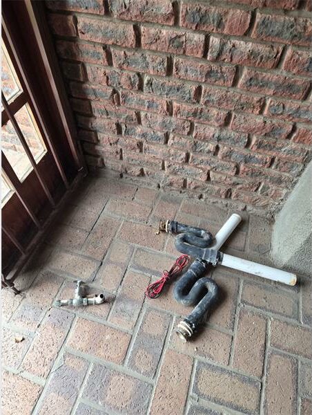tools and hardware on a brick floor