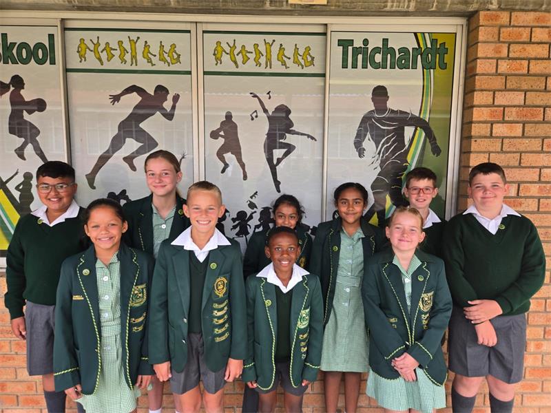 children in green school uniforms