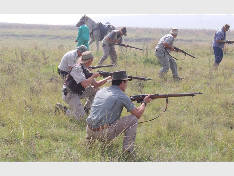 men dressed as boers with guns in their hands