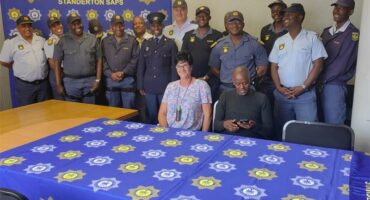 Police officers and officials at South African Police Service Crime Stop event in Standerton.