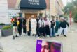 a group of learners in front of a theatre