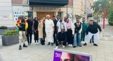 a group of learners in front of a theatre
