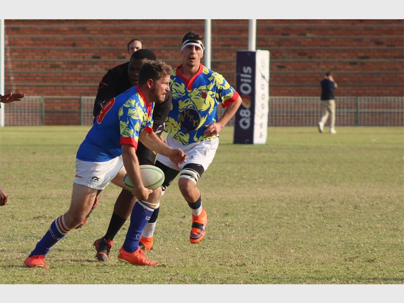 a rugby player runs with the ball