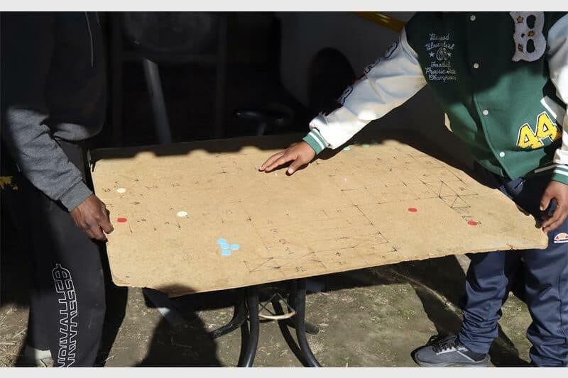 hands onto a cardboard