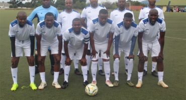 a soccer team in white kits