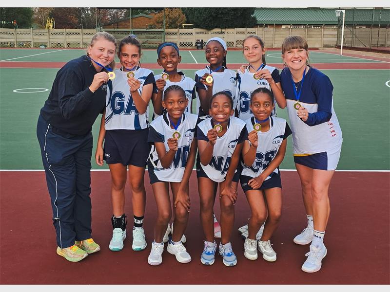A team of girls in blue sport outfits