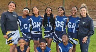 A team of girls in blue sport outfits