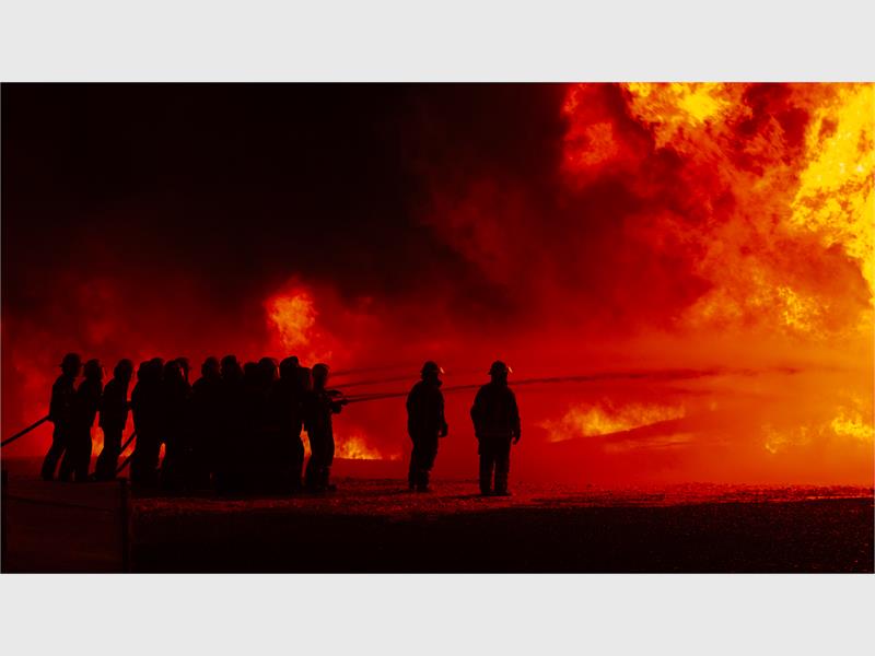 fire fighters working to put out a fire