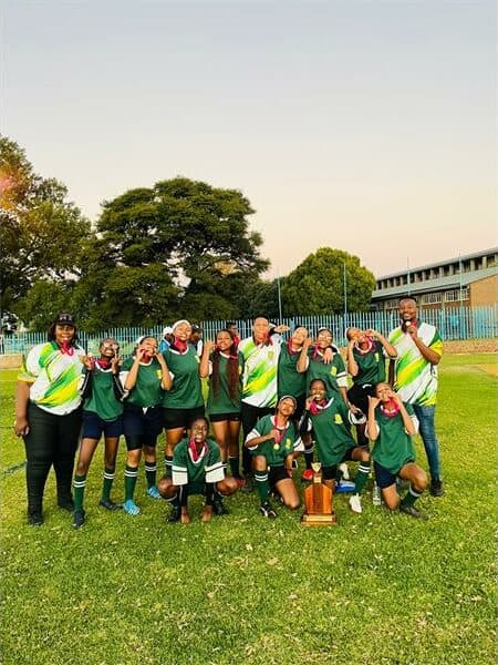 A team of girls with a trophy