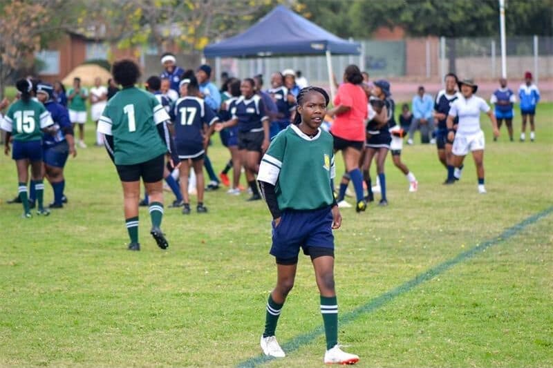 A girl in a rugby uniform