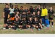 a hockey team in black sport kit