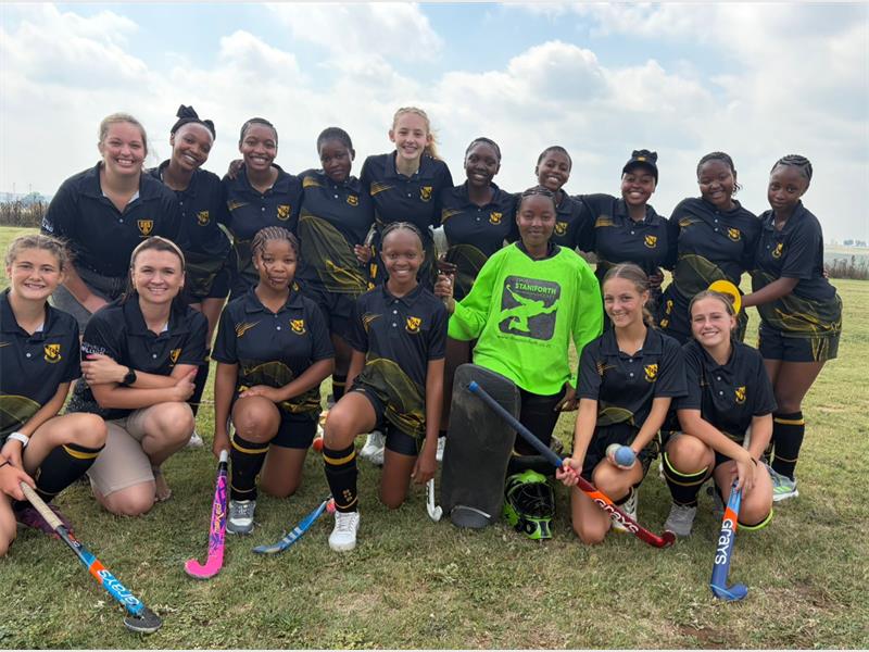 a hockey team in black sport kit