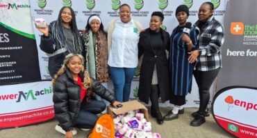 a group of women with sanitary towels donated