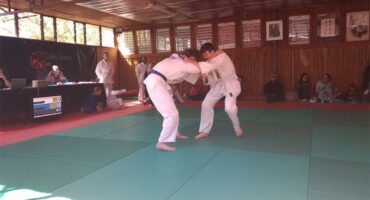 Two judo fighters in combat
