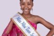 girl with a crown and a beauty pageant sash