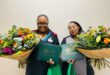 two women with flowers and rewards