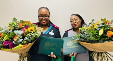 two women with flowers and rewards