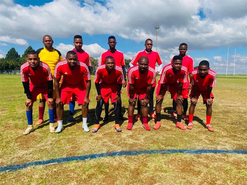 a soccer team with red kits