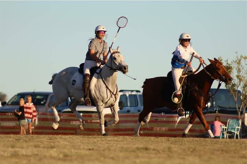 horse riders playing polo