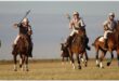 horse riders playing polo