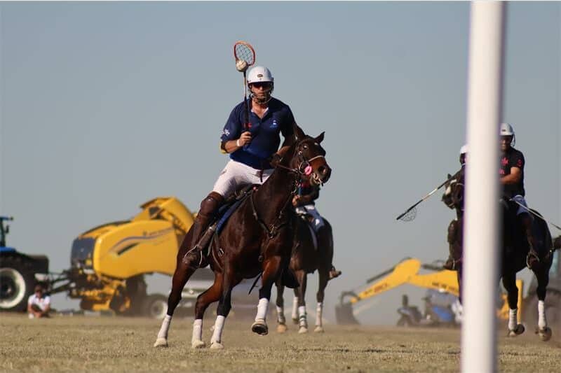 horse riders playing polo