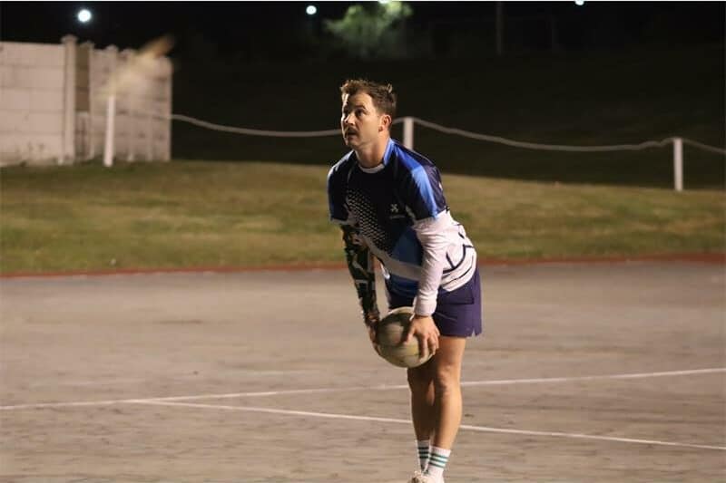 a player with the ball aims for the goal post