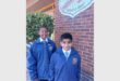 Two boys in blue school uniforms
