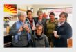a group of women with mugs