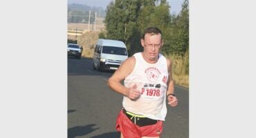 man running in the street