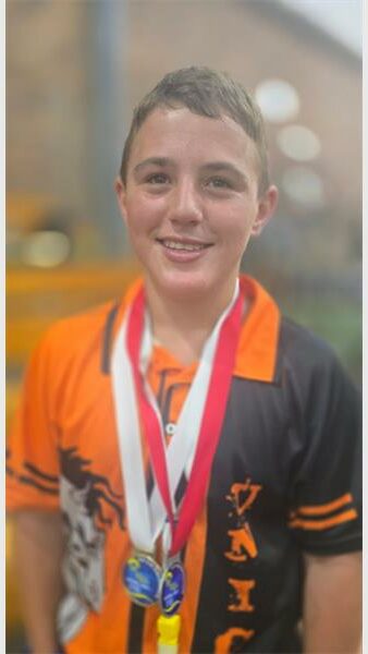 Boy with medals around his neck