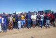 A large group of people with police officers