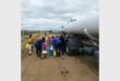 people getting water from a water tanker