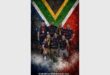 group of men in front of the South African flag
