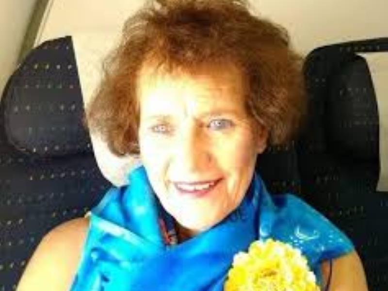an elderly woman with a blue scarf