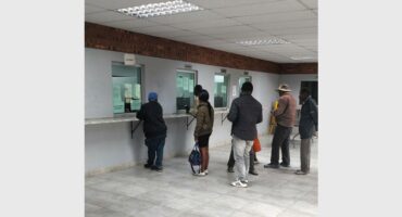 Residents in eMbalenhle queue to pay for their services. Photo: Mphikeleli Masangu