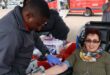 a nurse looks for a vein on a blood donor's arm