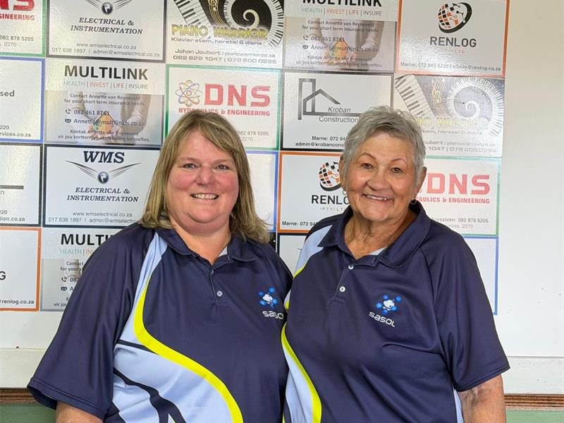 Two women in blue, sky blue and yellow sport shirts