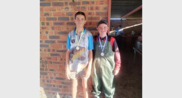 two young boys with medals around their necks
