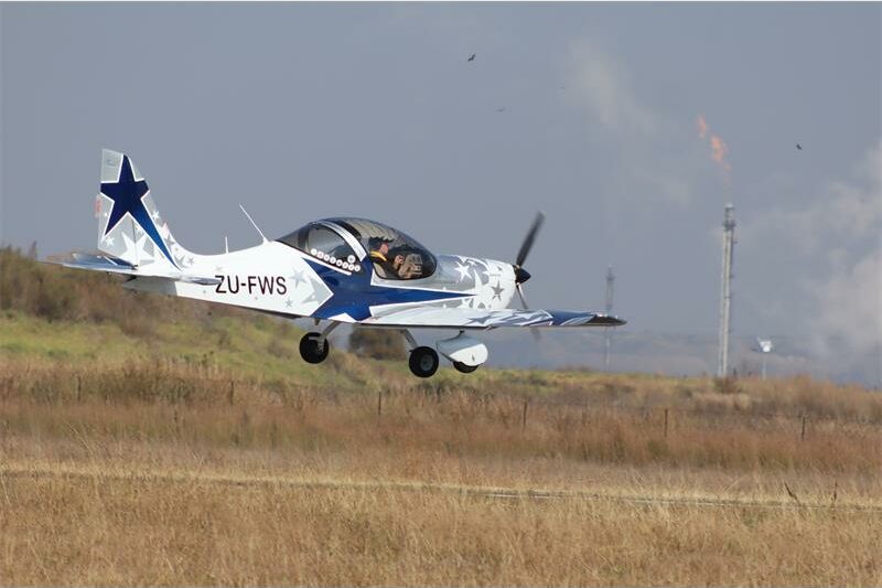 light airplane taking off from runway