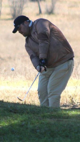 golf player in a brown jacket