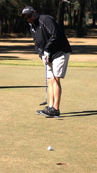 golf player in a black jacket